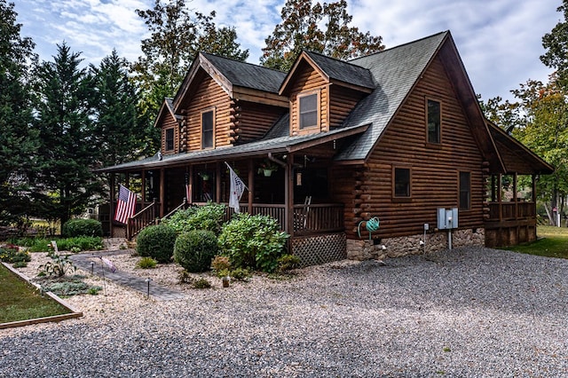 log cabin featuring a porch