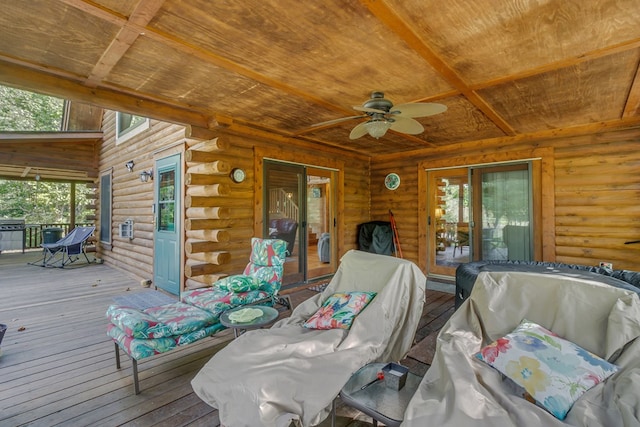 wooden terrace featuring ceiling fan