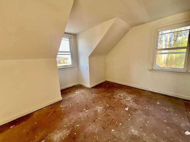 additional living space featuring vaulted ceiling