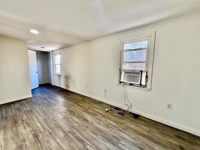 empty room featuring hardwood / wood-style flooring and cooling unit