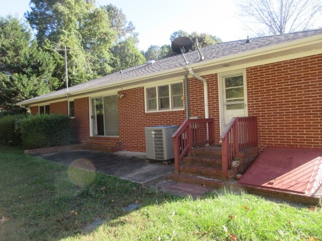 exterior space featuring a patio area and central AC