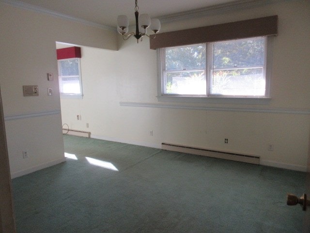 unfurnished dining area featuring baseboard heating, carpet, ornamental molding, and a notable chandelier