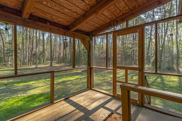 unfurnished sunroom with a view of trees