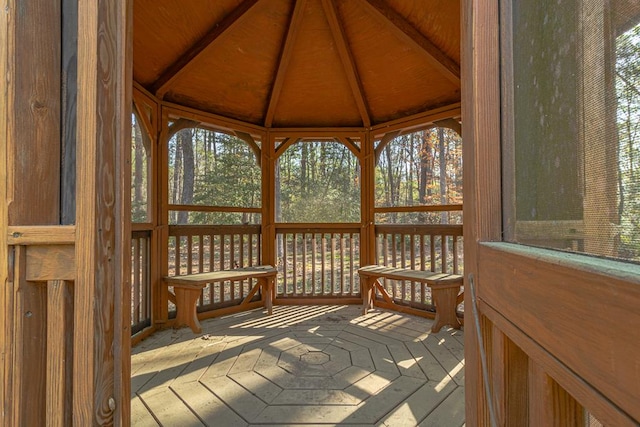 wooden terrace featuring a gazebo