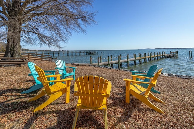 exterior space with a water view and a boat dock