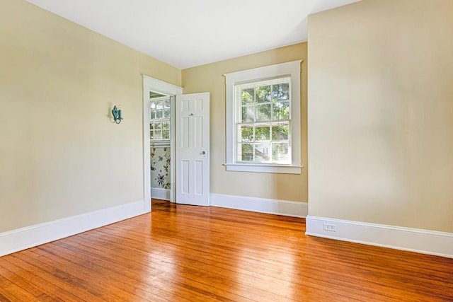 unfurnished room featuring light hardwood / wood-style floors