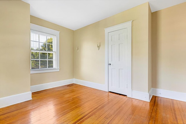 spare room with light hardwood / wood-style flooring