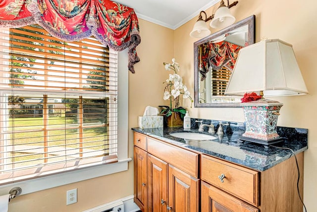 bathroom with vanity and ornamental molding