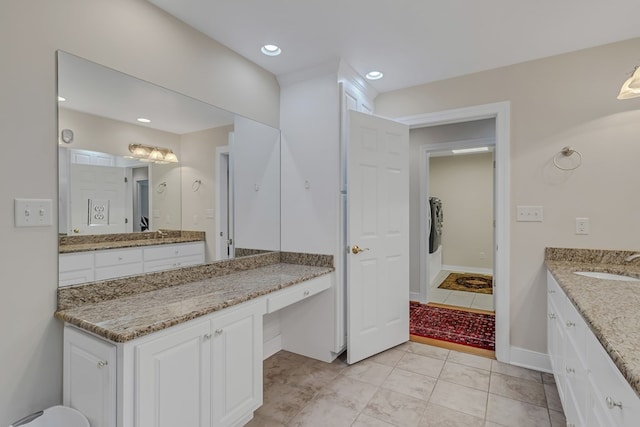 full bath featuring recessed lighting, vanity, and baseboards
