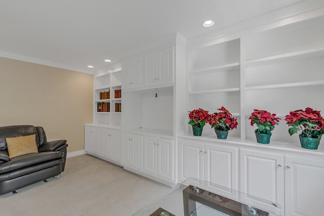 living area with recessed lighting, built in features, baseboards, and crown molding