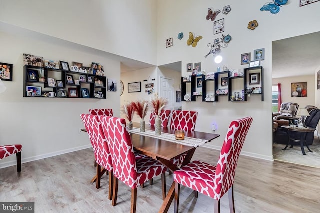 6 Dockside Ct, Montross, VA 22520 - dining room with baseboards, wood finished floors, and a towering ceiling