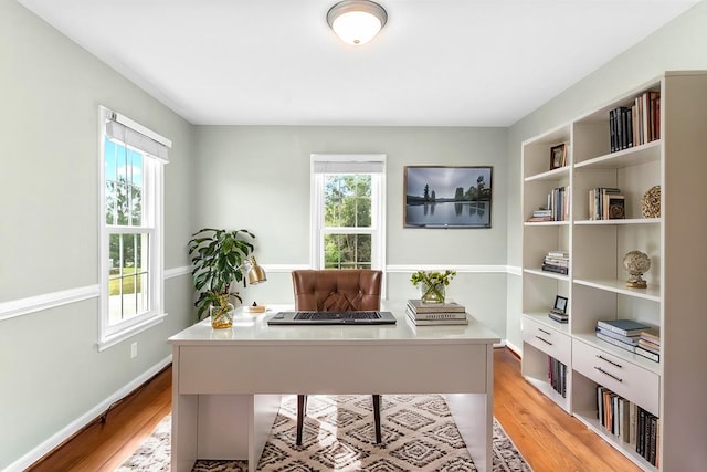 home office with light wood-type flooring