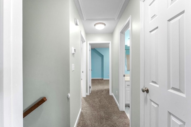 hall with dark colored carpet