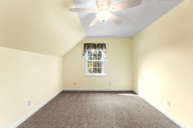 bonus room featuring lofted ceiling, carpet floors, and ceiling fan