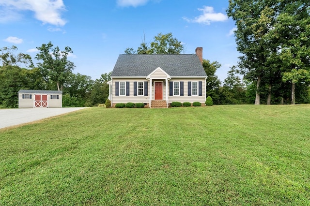 view of front facade featuring a shed and a front yard