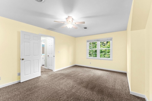 spare room with ceiling fan and carpet floors