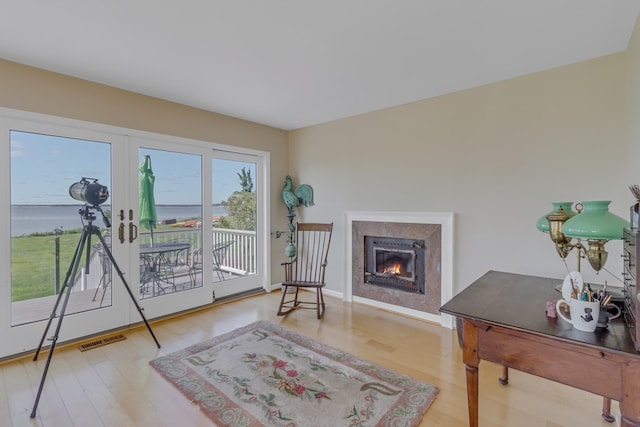 living area featuring hardwood / wood-style floors and french doors