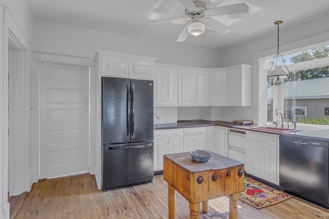 kitchen with ceiling fan, light hardwood / wood-style flooring, pendant lighting, white cabinets, and black appliances