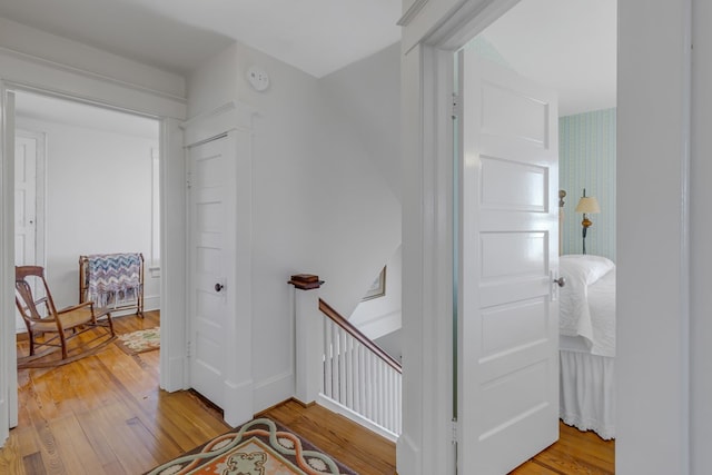 stairs with hardwood / wood-style flooring