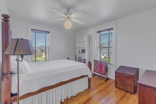 bedroom featuring ceiling fan and light hardwood / wood-style flooring