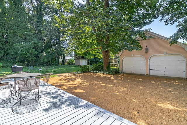 19 Cedardale Ln, Irvington, VA 22480 - wooden terrace featuring outdoor dining area and a garage