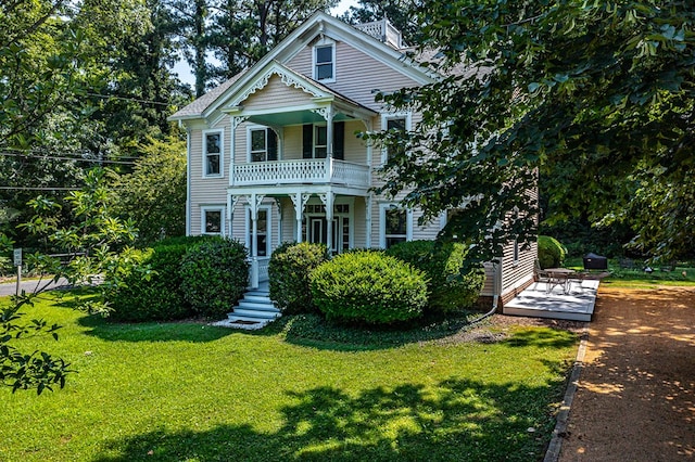 19 Cedardale Ln, Irvington, VA 22480 - view of front of home with a balcony and a front yard