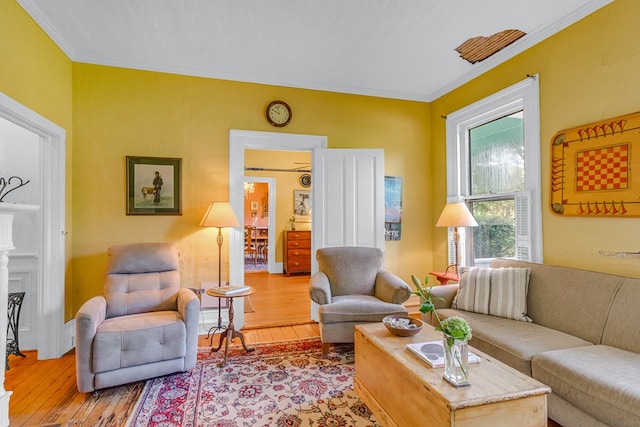 19 Cedardale Ln, Irvington, VA 22480 - living room featuring light wood finished floors and ornamental molding