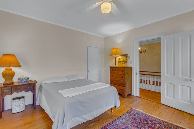 19 Cedardale Ln, Irvington, VA 22480 - bedroom featuring hardwood / wood-style floors, crown molding, a chandelier, and a ceiling fan