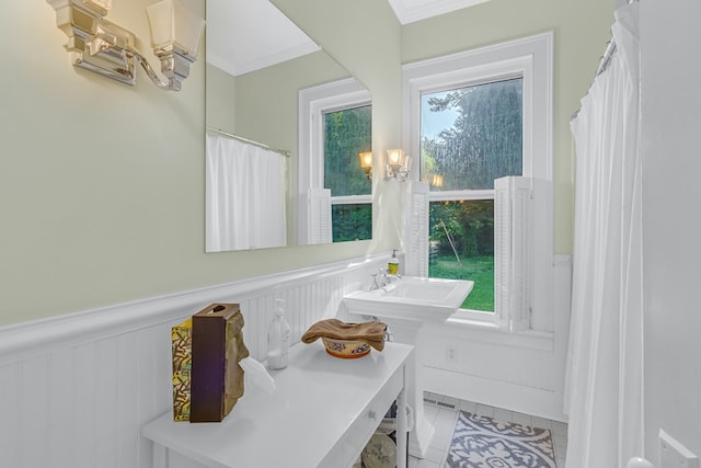 19 Cedardale Ln, Irvington, VA 22480 - full bathroom featuring wainscoting, ornamental molding, tile patterned flooring, and a decorative wall