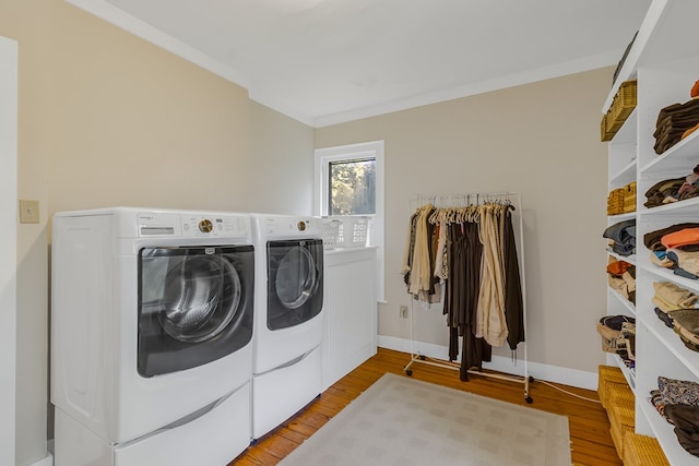 19 Cedardale Ln, Irvington, VA 22480 - laundry area with washing machine and dryer, light wood-type flooring, and crown molding