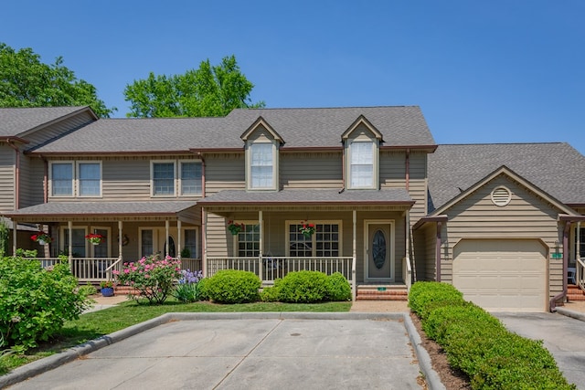 view of front facade with a porch and a garage