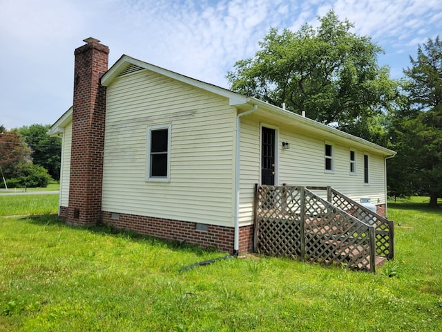 467 The Hook Rd, Warsaw, VA 22572 - back of property with crawl space, a chimney, and a yard