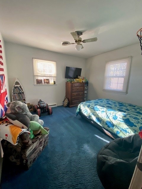 carpeted bedroom featuring visible vents and a ceiling fan