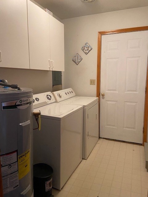 laundry area featuring cabinet space, separate washer and dryer, light floors, and electric water heater