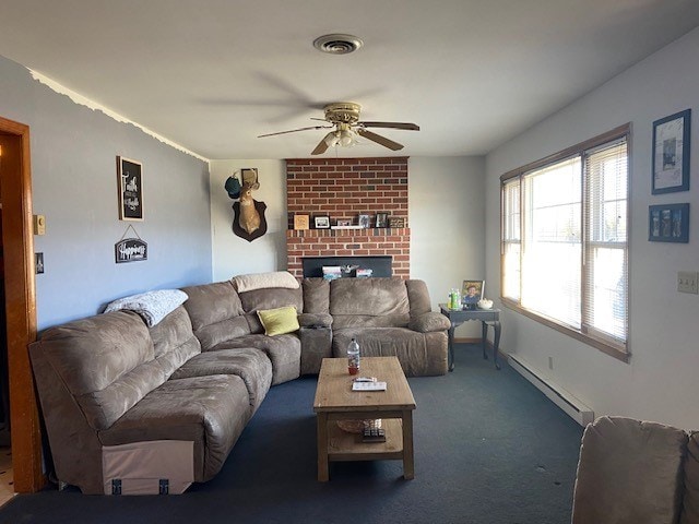 living area featuring a baseboard heating unit, visible vents, a ceiling fan, a brick fireplace, and dark colored carpet