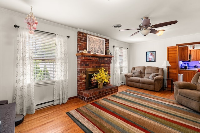 31 Bunker Hill Rd, Farnham, VA 22460 - living area featuring baseboard heating, light wood-type flooring, crown molding, ceiling fan, and a brick fireplace