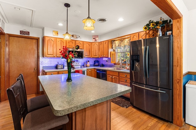 31 Bunker Hill Rd, Farnham, VA 22460 - kitchen with refrigerator with ice dispenser, stainless steel microwave, black dishwasher, white electric stove, and a breakfast bar