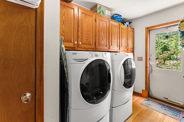 31 Bunker Hill Rd, Farnham, VA 22460 - laundry room featuring cabinet space, washer and clothes dryer, light wood finished floors, and a wall mounted AC