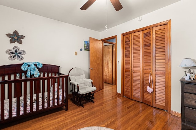 31 Bunker Hill Rd, Farnham, VA 22460 - bedroom featuring a closet, wood finished floors, a ceiling fan, and a nursery area