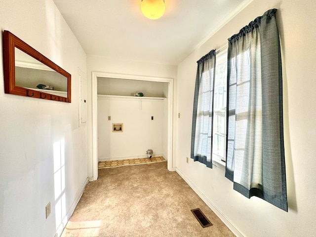 clothes washing area with washer hookup and light colored carpet