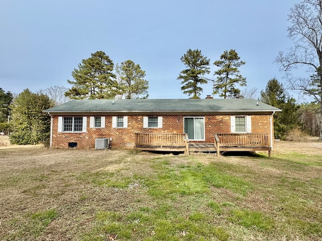 back of property with central AC, a yard, and a deck