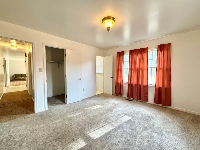 unfurnished bedroom featuring carpet flooring and a closet