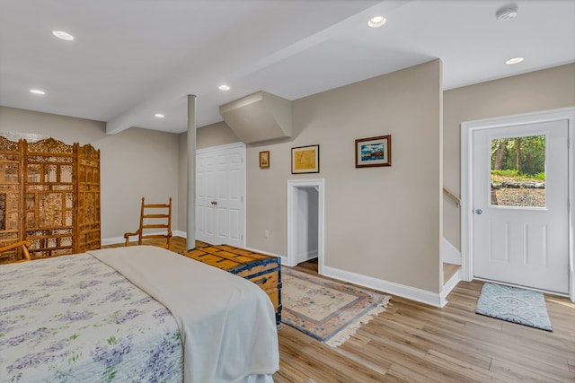 bedroom featuring recessed lighting, baseboards, and light wood-type flooring