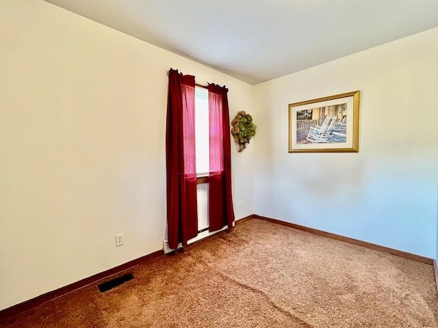 empty room featuring carpet floors