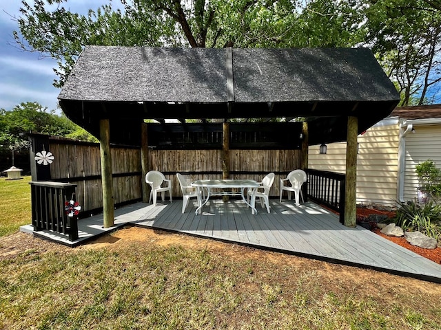 wooden deck featuring a yard