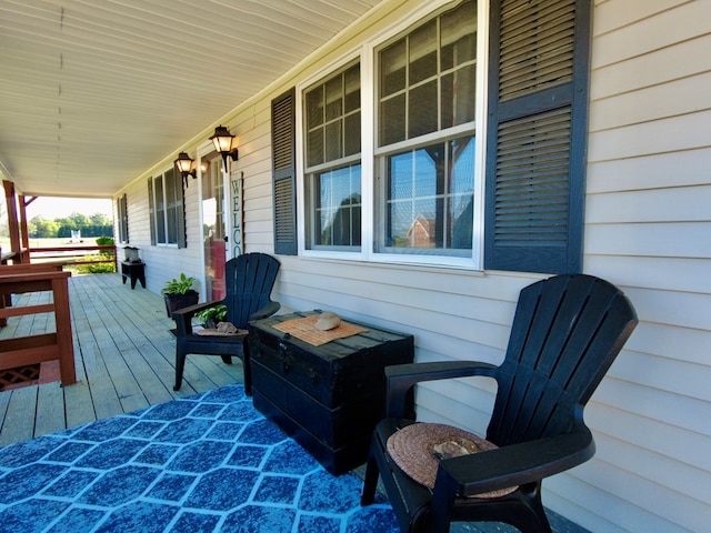 wooden terrace with a porch