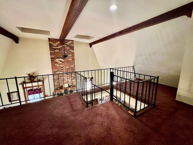 stairs with vaulted ceiling with beams and carpet floors