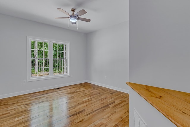 282 Regina Rd, Lancaster, VA 22503 - spare room with light wood-style flooring, baseboards, and a ceiling fan