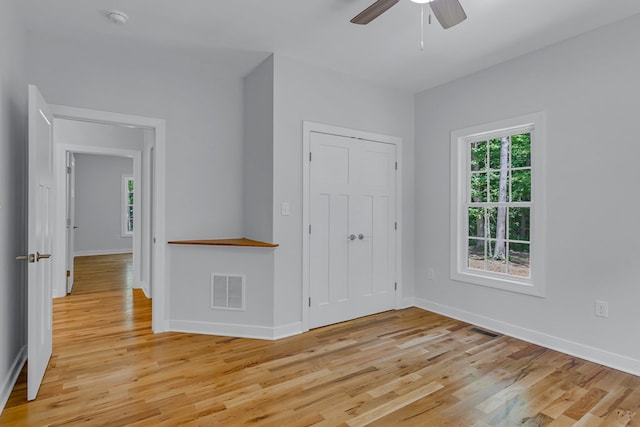 282 Regina Rd, Lancaster, VA 22503 - unfurnished bedroom with light wood-style flooring, baseboards, and a closet