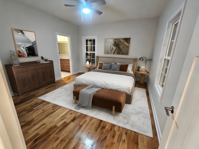 282 Regina Rd, Lancaster, VA 22503 - bedroom with wood finished floors, baseboards, ensuite bathroom, and ceiling fan